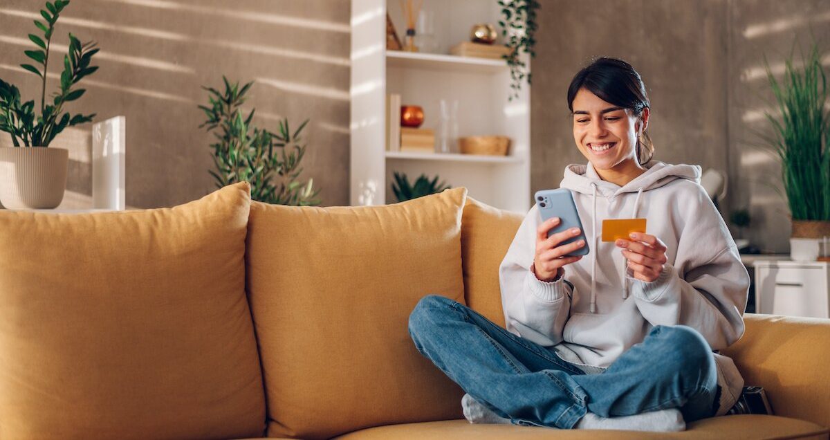 Woman using a charge card for online shopping